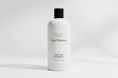 16 oz white plastic bottle of pine tar shampoo with Lux Natures logo with green leaf